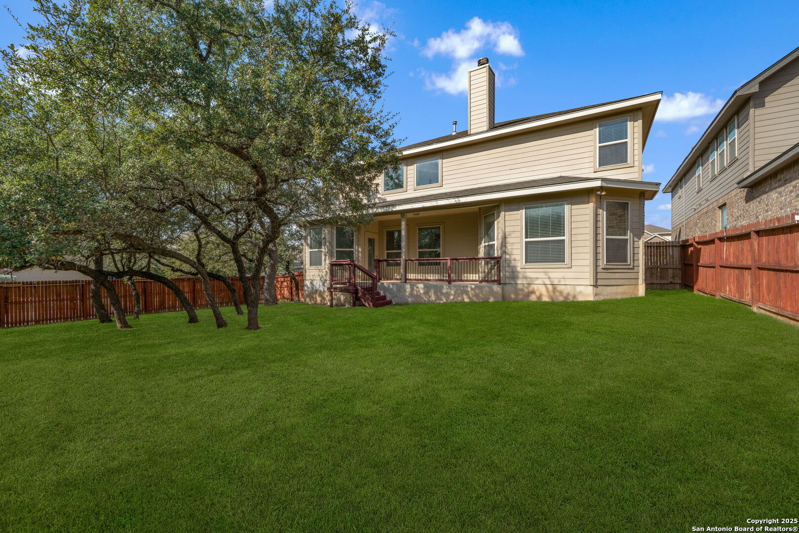 8326 Hydrangea Path Boerne, TX 78015 - Photo 37 of 39 a front view of house with yard and green space