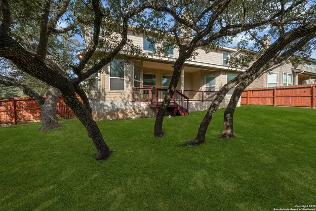 a view of a house with a backyard