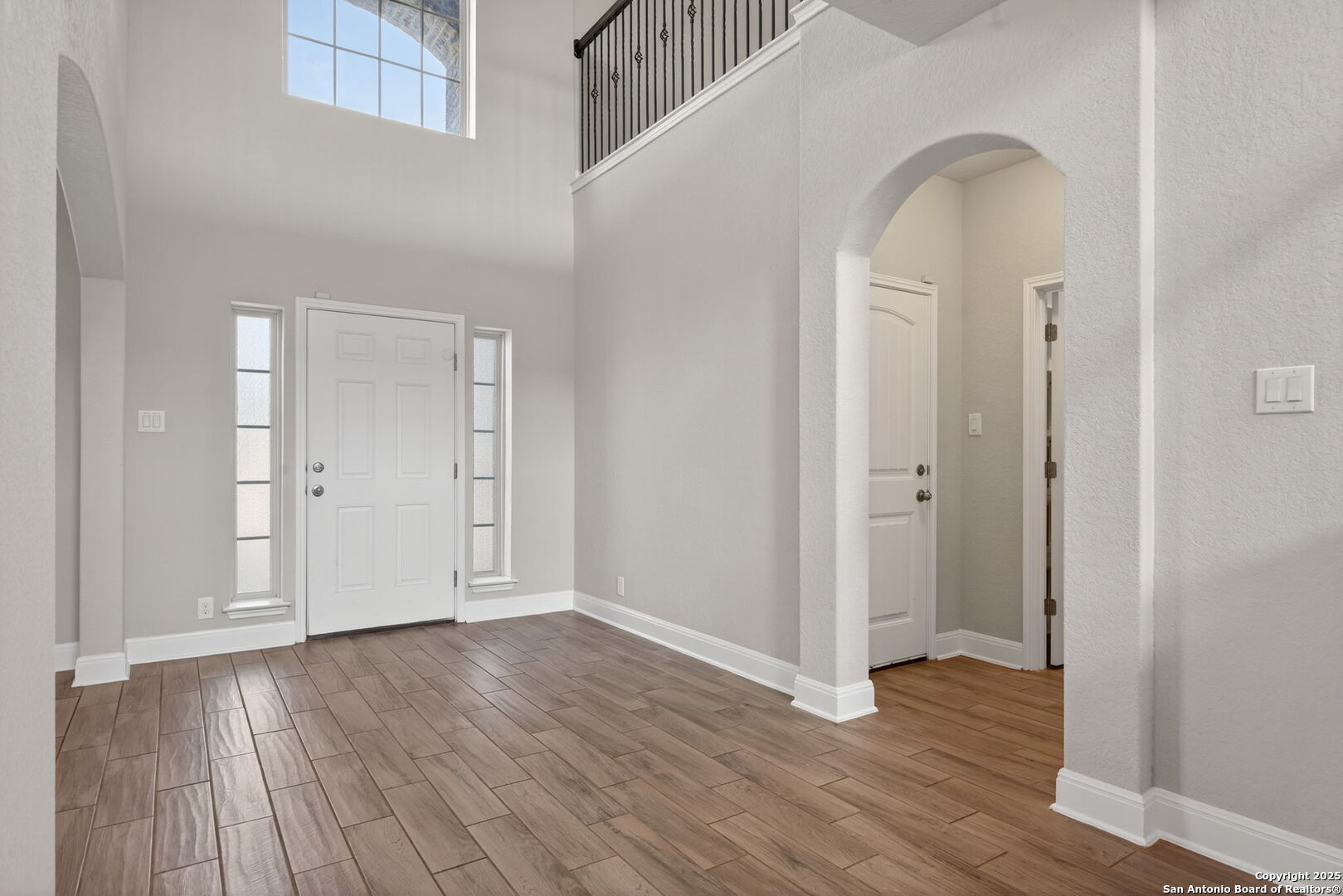 8326 Hydrangea Path Boerne, TX 78015 - Photo 5 of 39 an empty room with wooden floor and closet