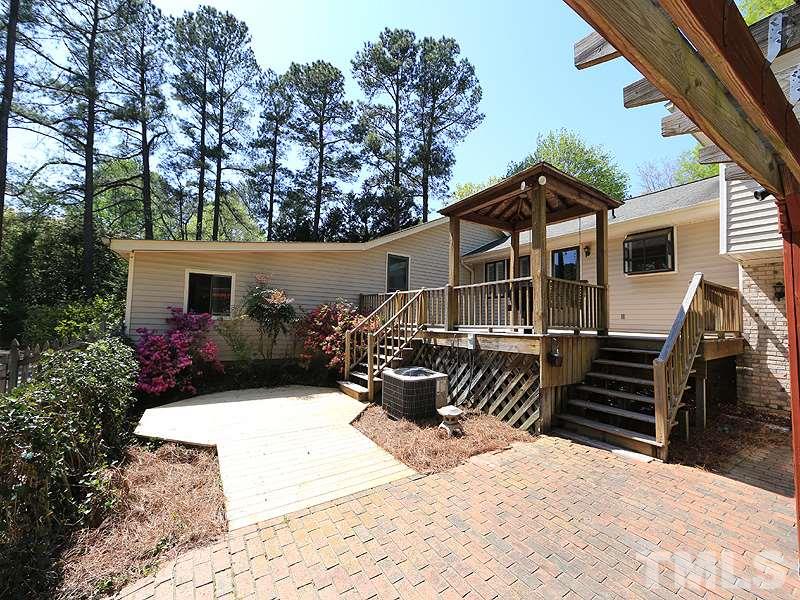 1504 Stratlen Court Raleigh, NC 27615 - Photo 14 of 17 a view of a house with backyard and sitting area