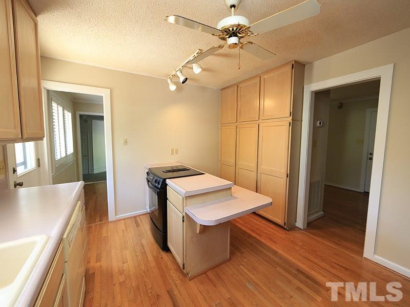 1504 Stratlen Court Raleigh, NC 27615 - Photo 5 of 17 a room with a table and chairs