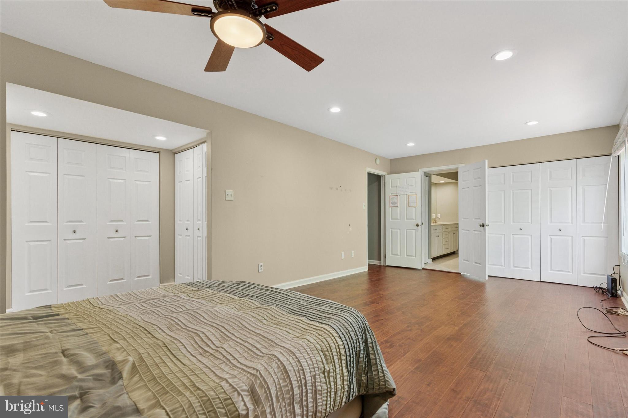 11 Ingham Way New Hope, PA 18938 - Photo 9 of 15 a spacious bedroom with a bed and a ceiling fan