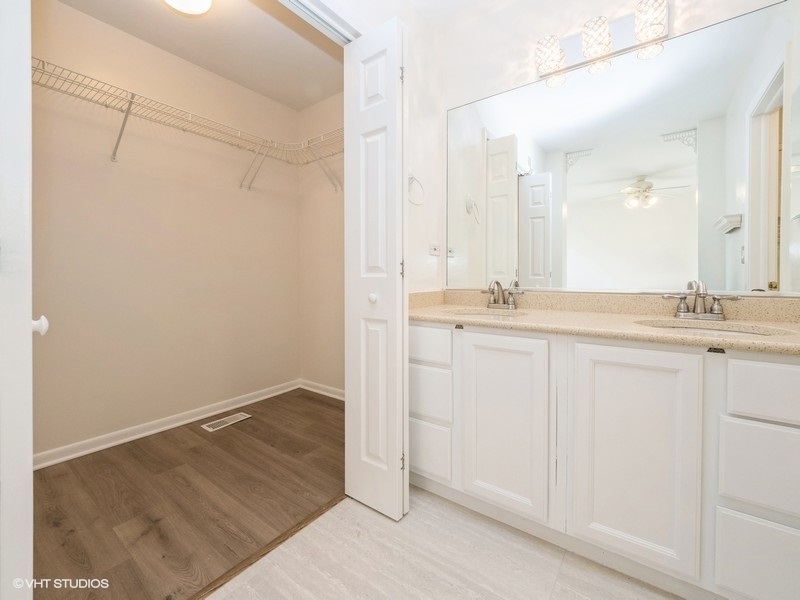 140 Crescent Lane Schaumburg, IL 60193 - Photo 12 of 21 a bathroom with a sink and a mirror