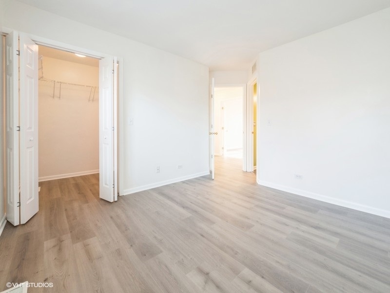 140 Crescent Lane Schaumburg, IL 60193 - Photo 14 of 21 a view of an empty room and wooden floor