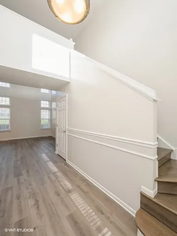 a view of empty room with window and entryway