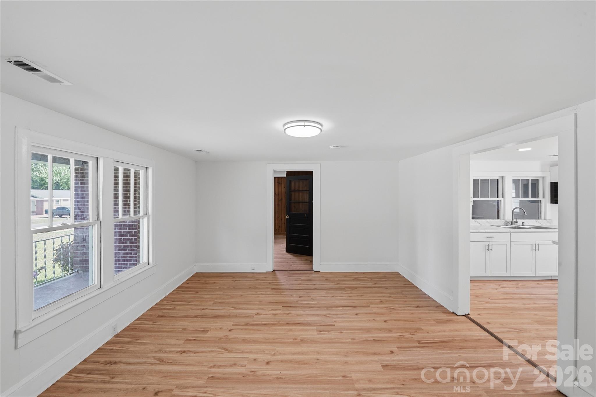 2231 Claremont Road Newton, NC 28658 - Photo 31 of 39 a big room with wooden floor and windows