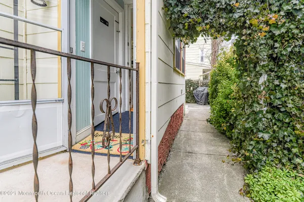 a backyard of a house with table and chairs