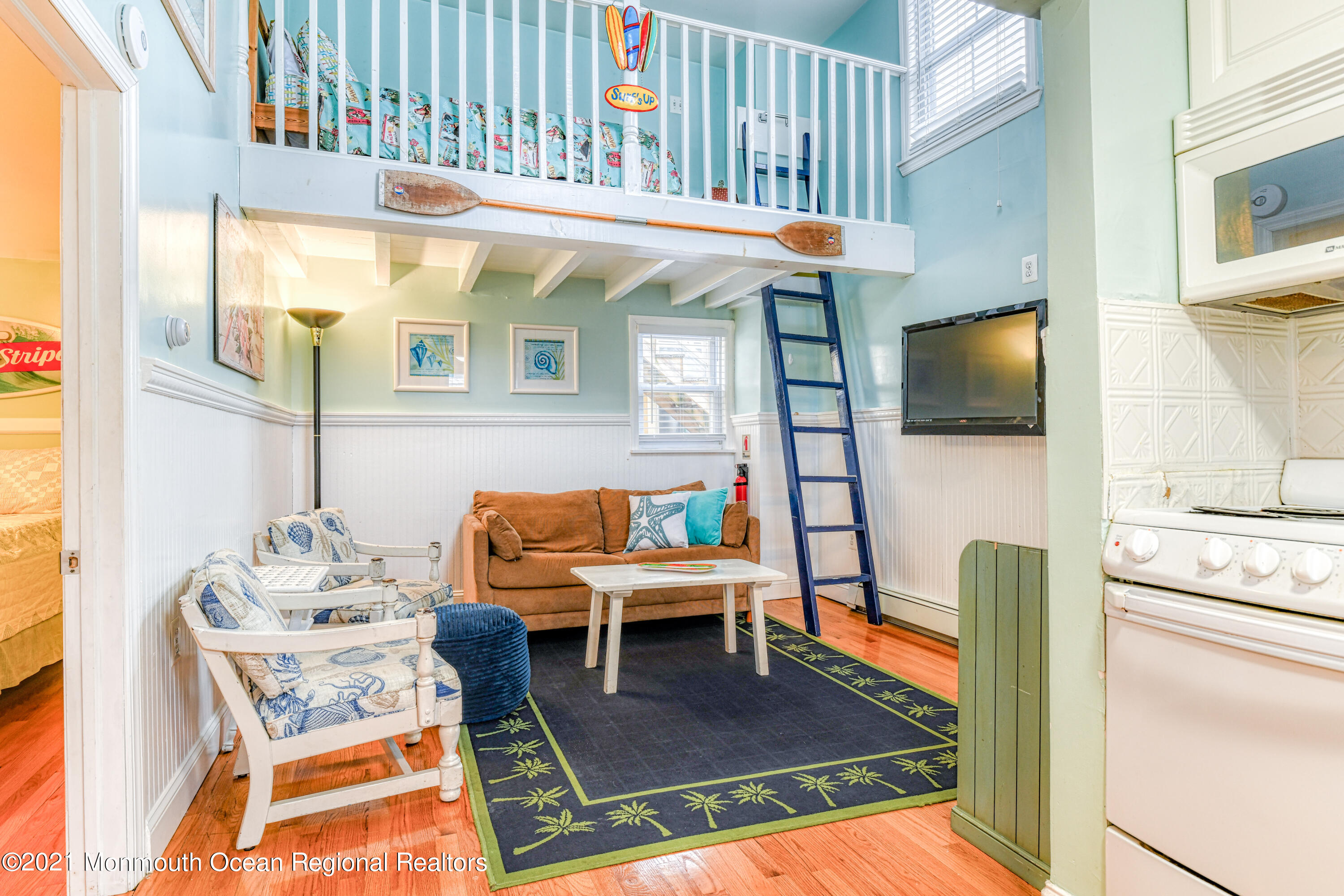 35 Ocean Pathway, Unit 4 Ocean Grove, NJ 07756 - Photo 3 of 15 a living room with furniture and a flat screen tv