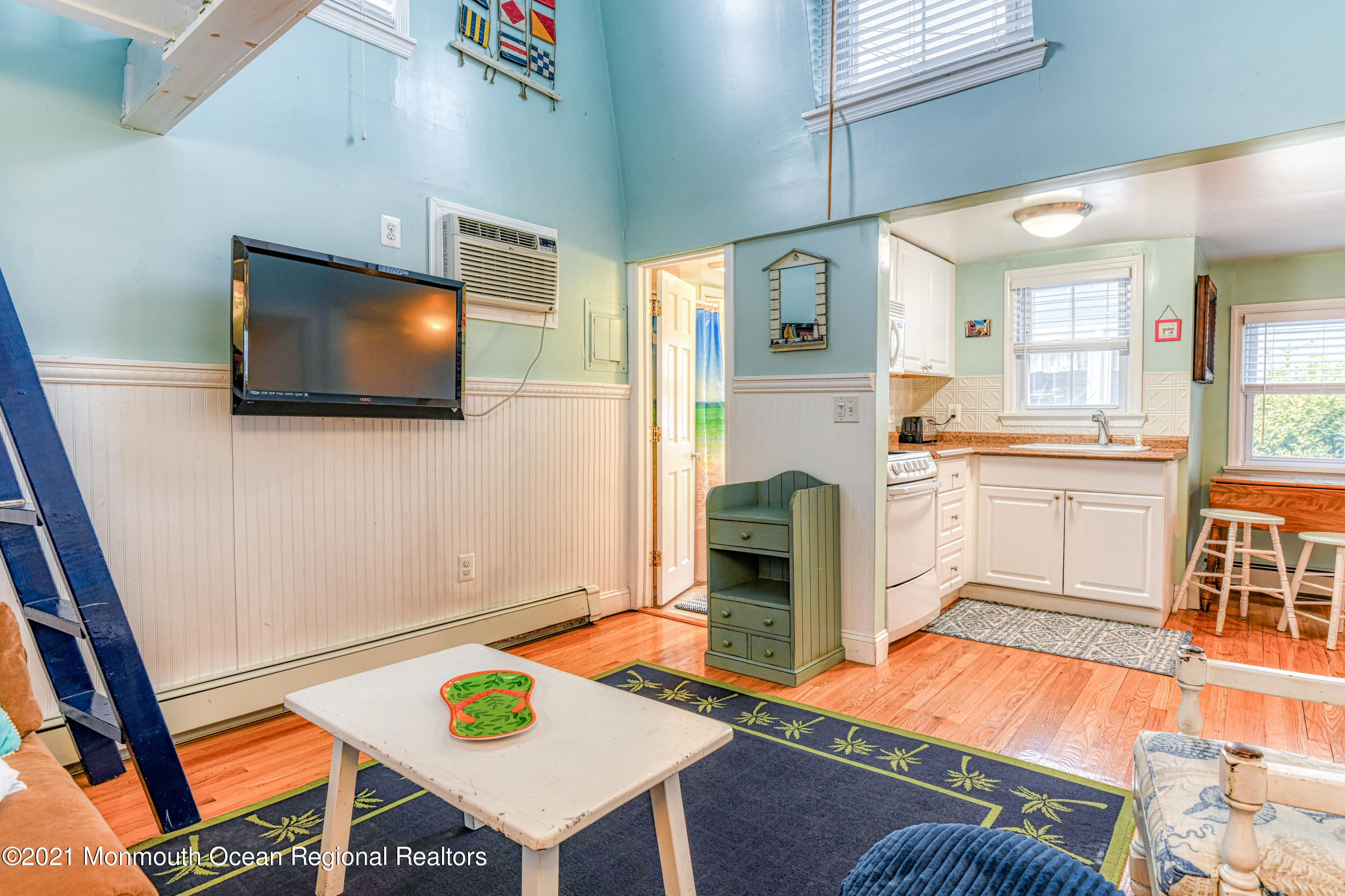 35 Ocean Pathway, Unit 4 Ocean Grove, NJ 07756 - Photo 4 of 15 a living room with furniture and a flat screen tv