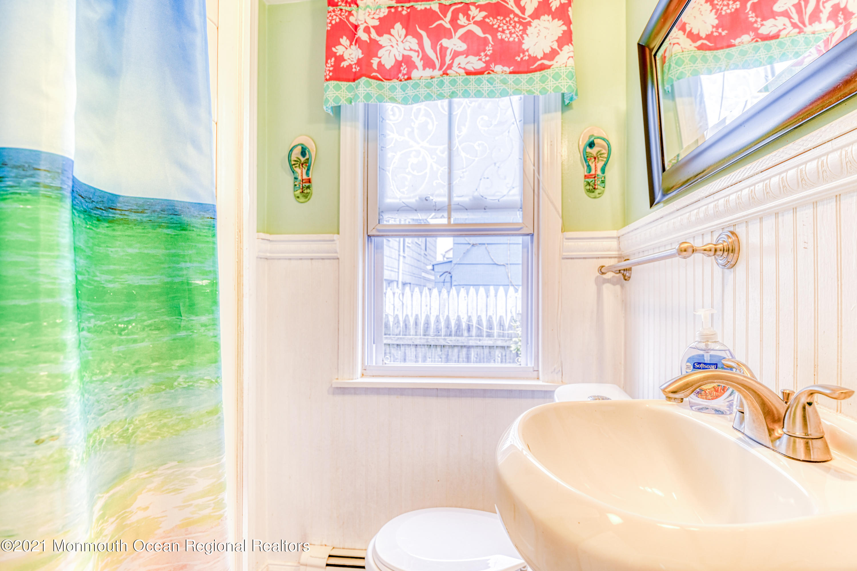 35 Ocean Pathway, Unit 4 Ocean Grove, NJ 07756 - Photo 8 of 15 a bathroom with a sink and a mirror