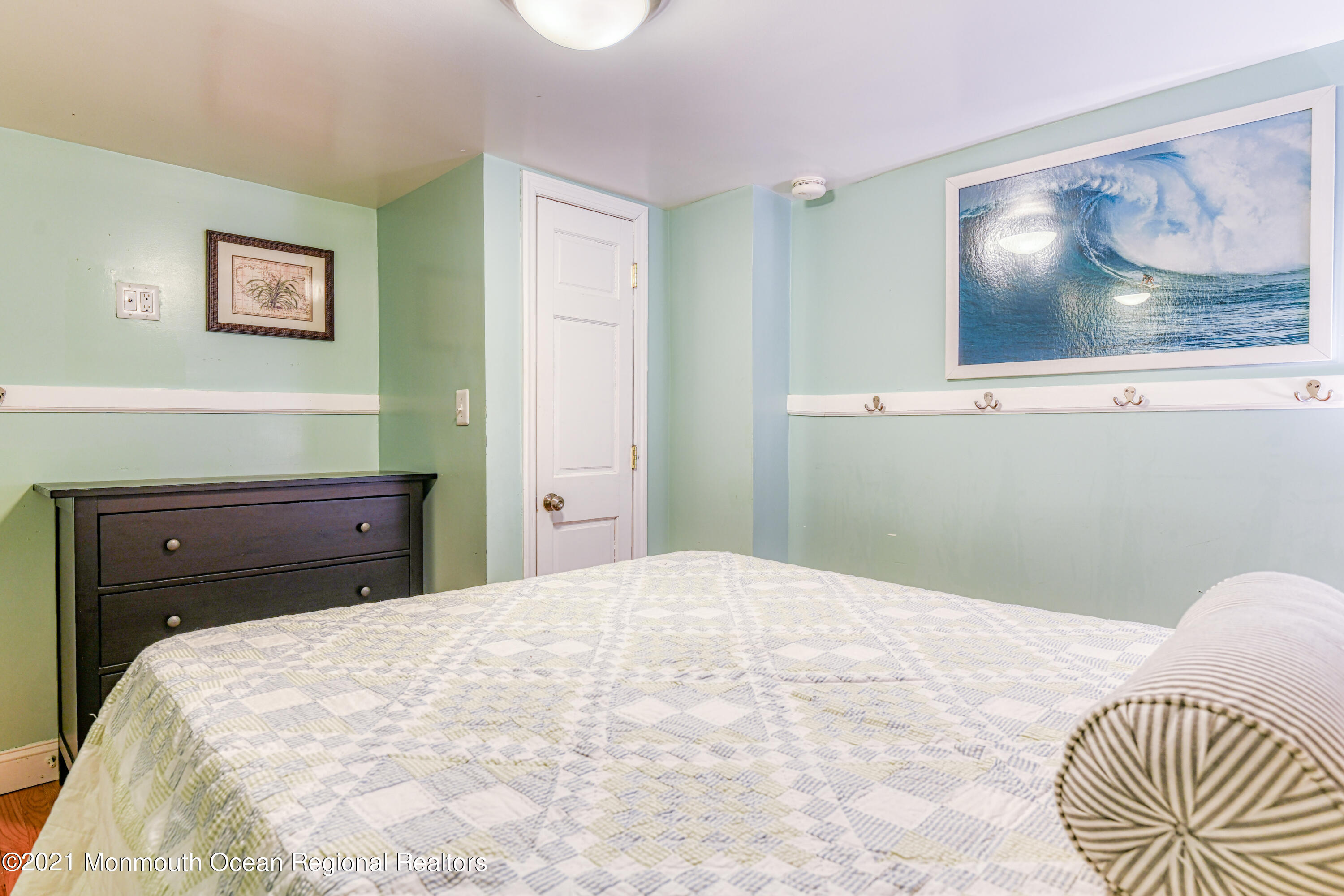 35 Ocean Pathway, Unit 4 Ocean Grove, NJ 07756 - Photo 10 of 15 a bedroom with a bed and a painting on the wall
