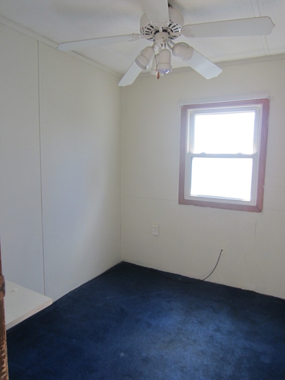 3040 Cranberry Highway, Unit 10 Wareham, MA 02538 - Photo 11 of 22 an empty room with a window