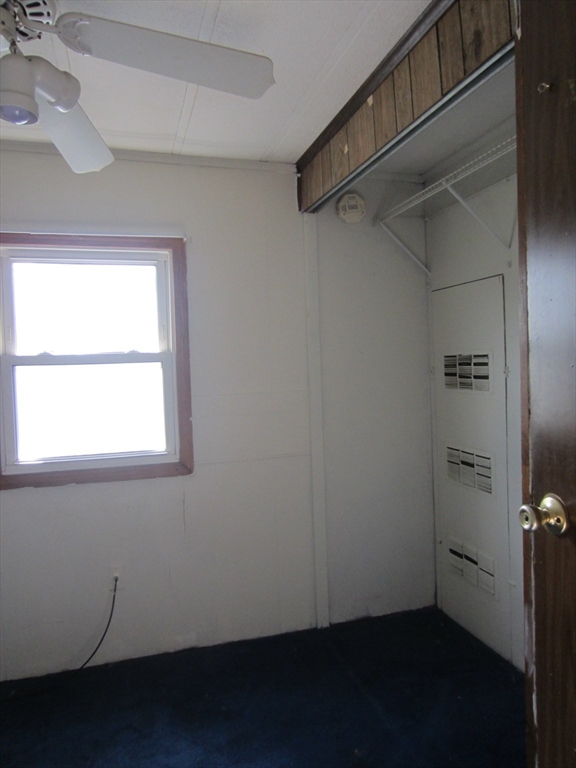 3040 Cranberry Highway, Unit 10 Wareham, MA 02538 - Photo 12 of 22 a view of a room with rack on the wall and a window