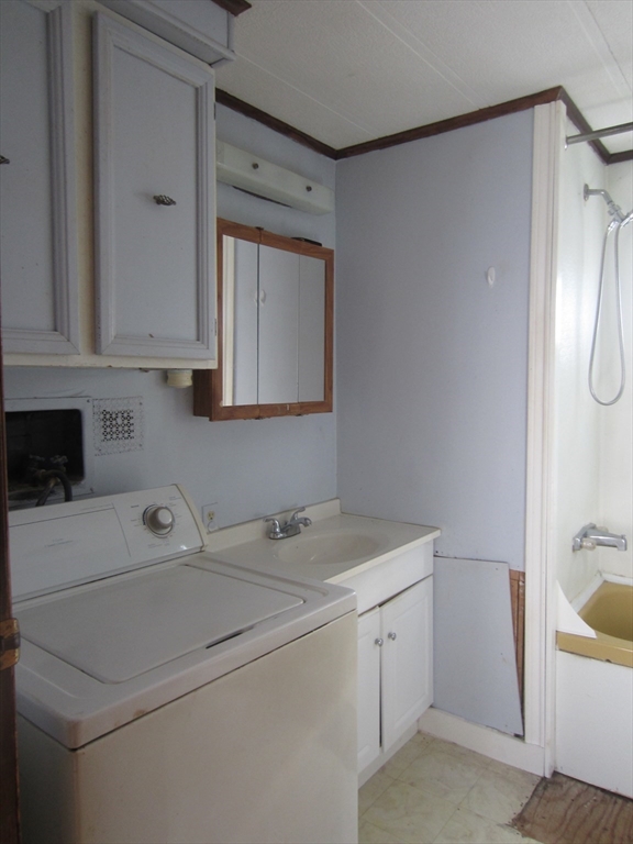 3040 Cranberry Highway, Unit 10 Wareham, MA 02538 - Photo 13 of 22 a utility room with dryer and washer