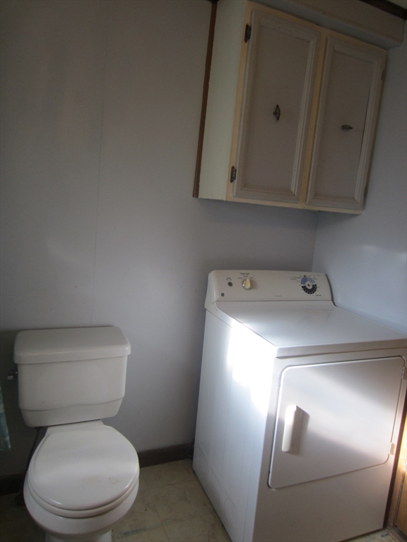 3040 Cranberry Highway, Unit 10 Wareham, MA 02538 - Photo 15 of 22 a white toilet sitting next to a sink