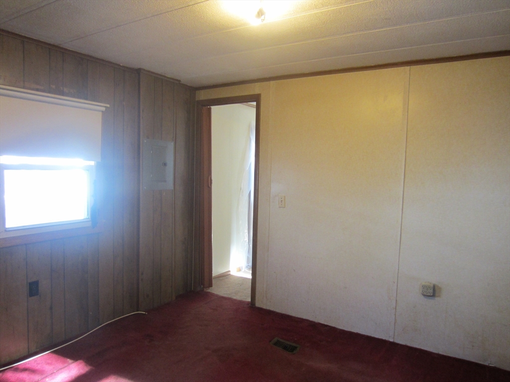 3040 Cranberry Highway, Unit 10 Wareham, MA 02538 - Photo 17 of 22 an empty room with windows