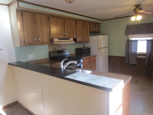 a view of a room with a barbeque grill and granite floor