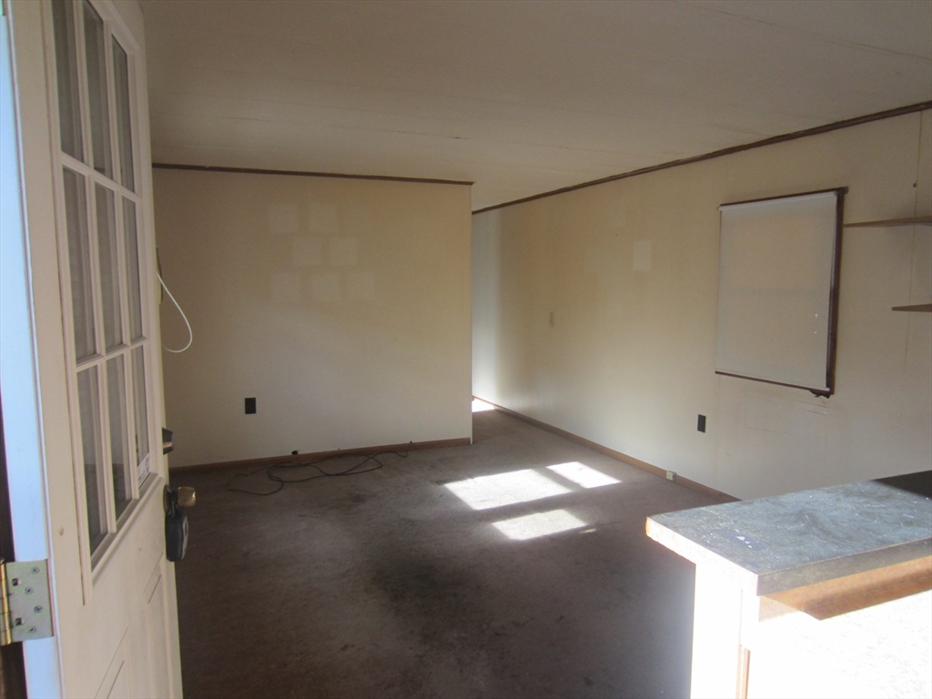3040 Cranberry Highway, Unit 10 Wareham, MA 02538 - Photo 7 of 22 a view of a room with a barbeque grill and granite floor