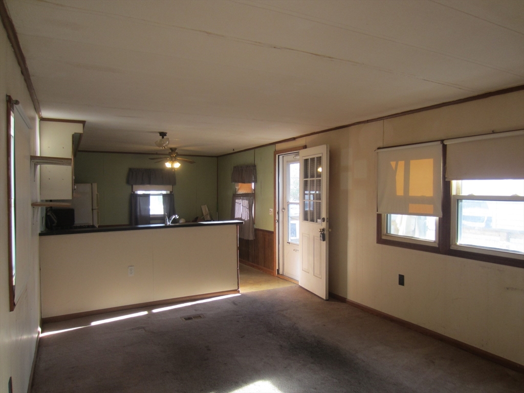 3040 Cranberry Highway, Unit 10 Wareham, MA 02538 - Photo 8 of 22 a view of a living room with furniture and a window