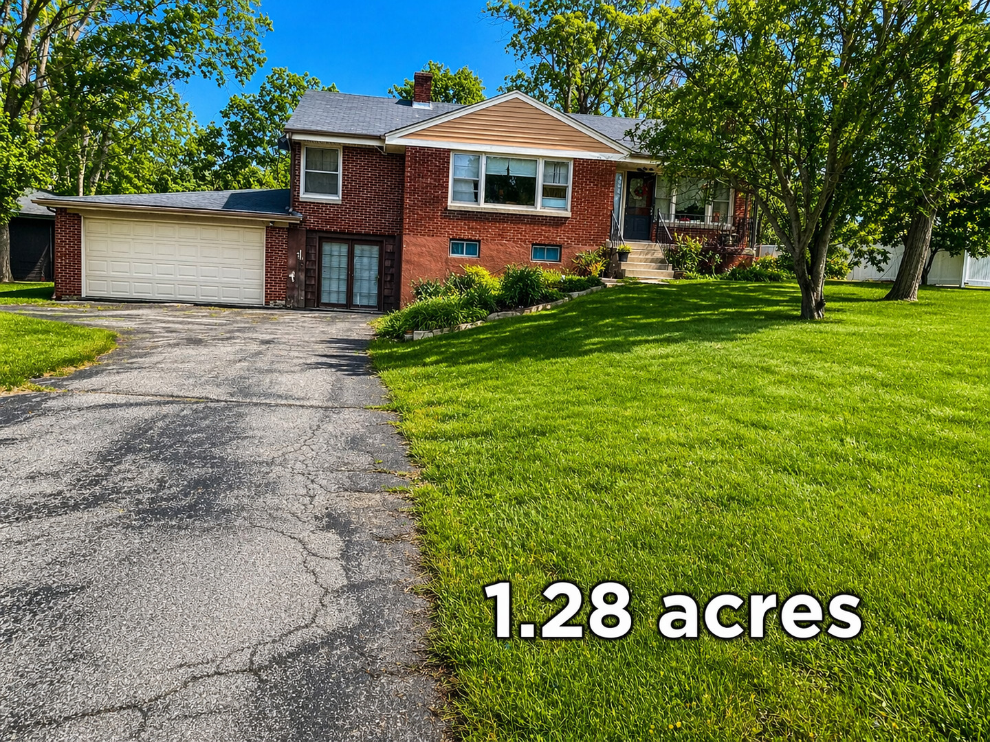 22W130 Irving Park Road Medinah, IL 60157 - Photo 3 of 5 a front view of house with yard and green space