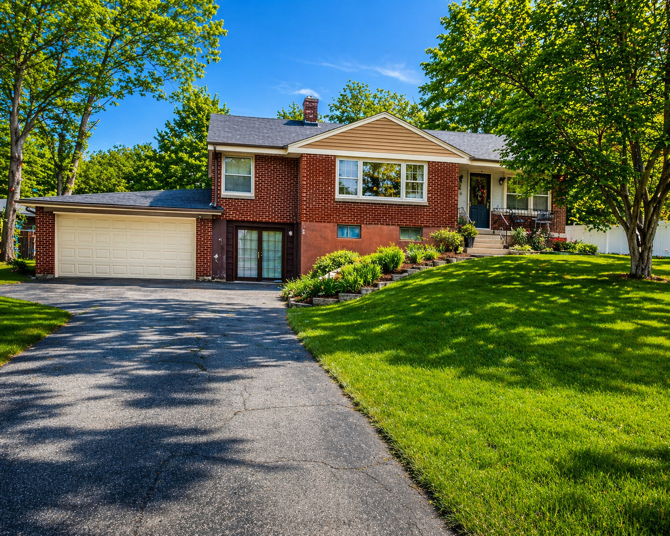 22W130 Irving Park Road Medinah, IL 60157 - Photo 4 of 5 a front view of a house with a garden
