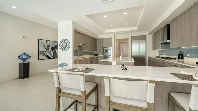 a spacious bedroom with a bed a window and a flat screen television