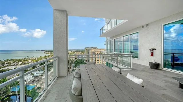 a bedroom with furniture and a flat screen tv