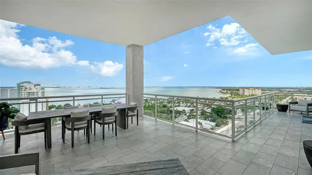 a bathroom with a sink double vanity granite tub shower and a mirror