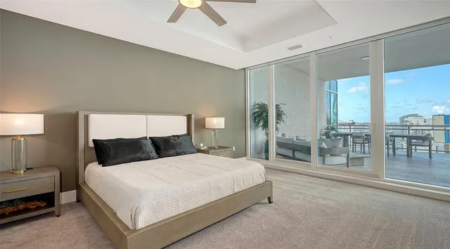 a view of a swimming pool with a deck and a backyard