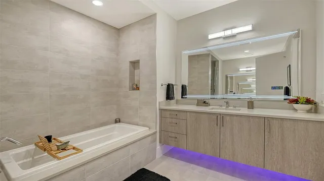 a living room with furniture a rug and white walls