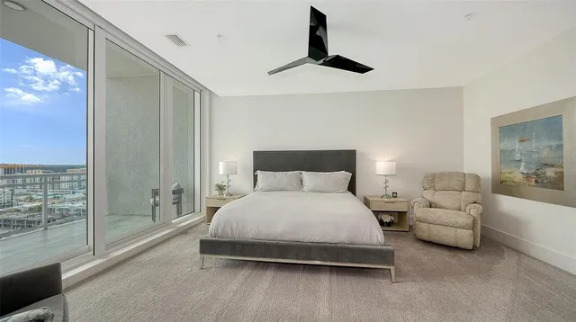 a view of a chairs and table in a patio