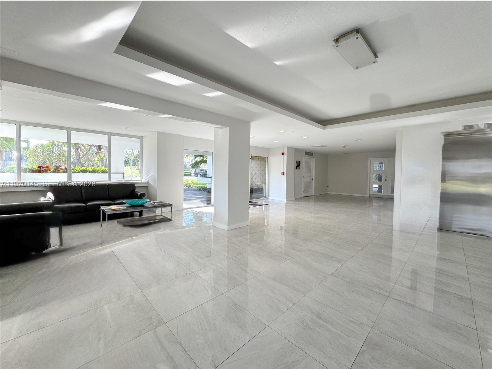 555 Crandon Boulevard, Unit 82 Key Biscayne, FL 33149 - Photo 21 of 28 a lobby with furniture and window