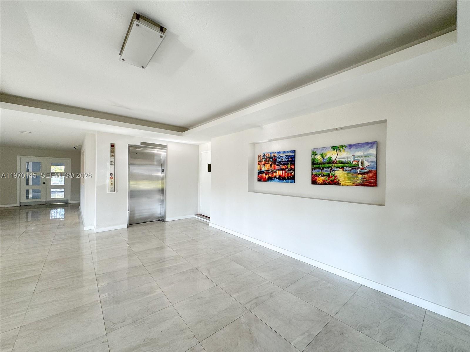 555 Crandon Boulevard, Unit 82 Key Biscayne, FL 33149 - Photo 22 of 28 an empty room with shelves and closet