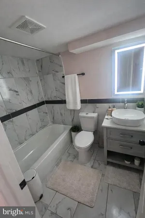 a bathroom with a toilet sink and bathtub