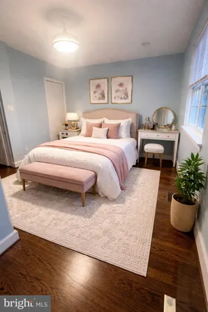 a spacious bedroom with a bed and a couch