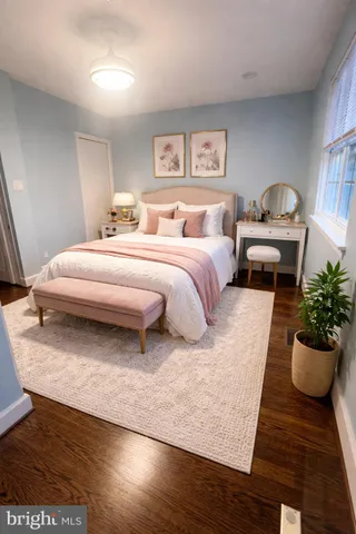 a spacious bedroom with a bed and a couch