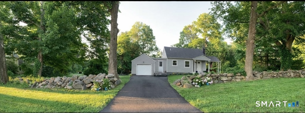 40 Mt Pleasant Road Newtown, CT 06470 - Photo 1 of 23 a front view of a house with a yard