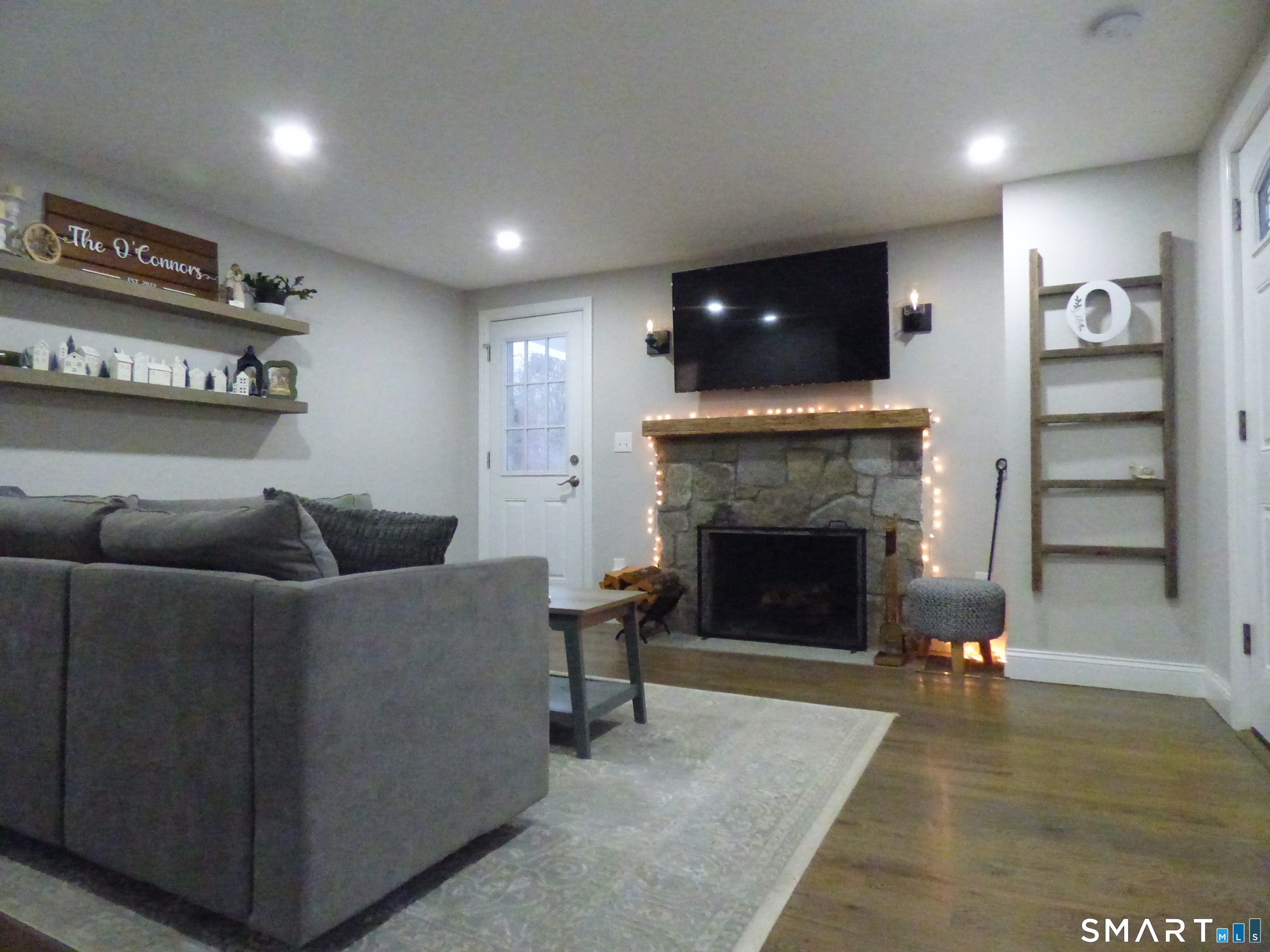 40 Mt Pleasant Road Newtown, CT 06470 - Photo 11 of 23 a living room with furniture and a fireplace