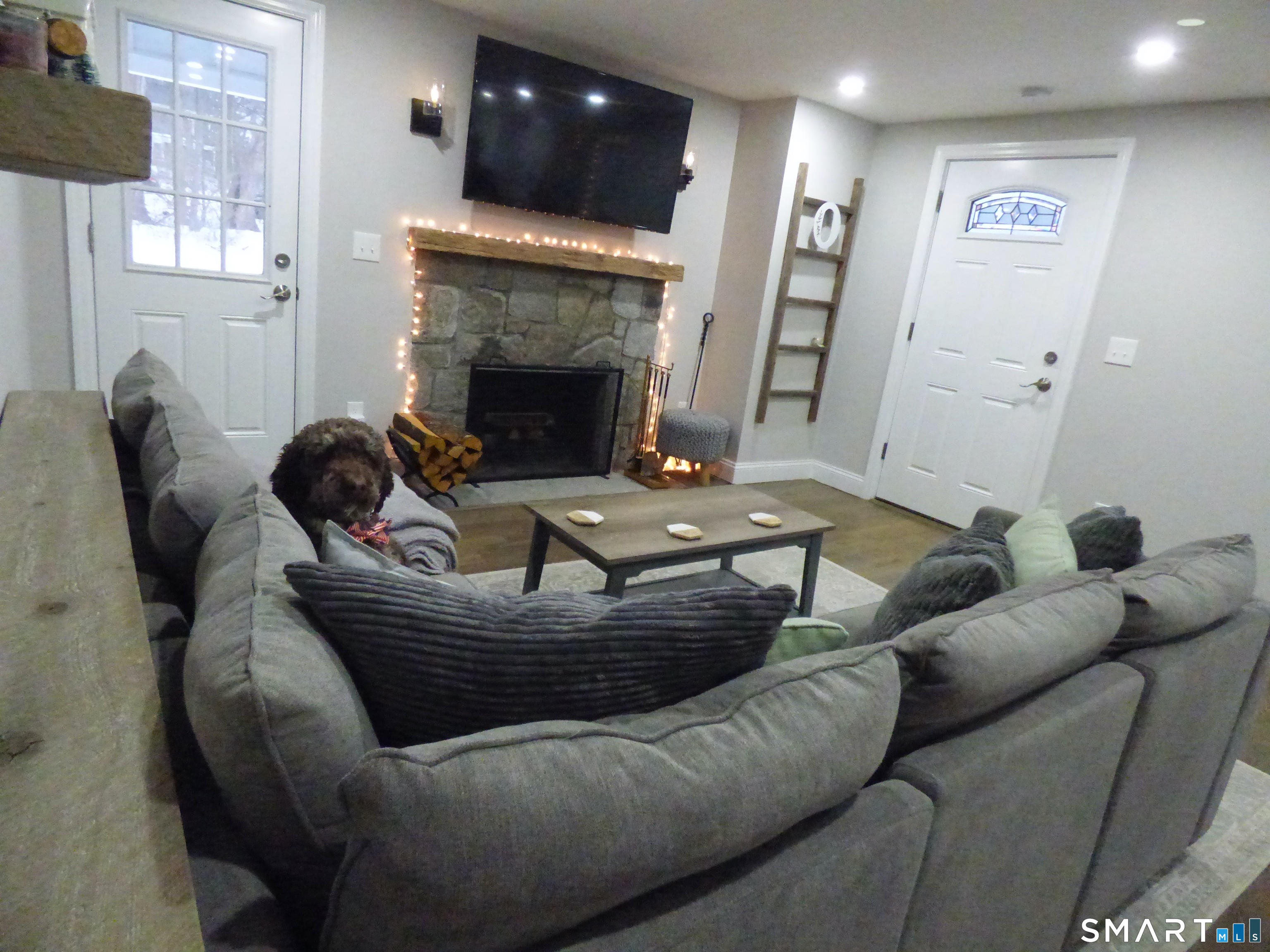 40 Mt Pleasant Road Newtown, CT 06470 - Photo 12 of 23 a living room with furniture and a fireplace