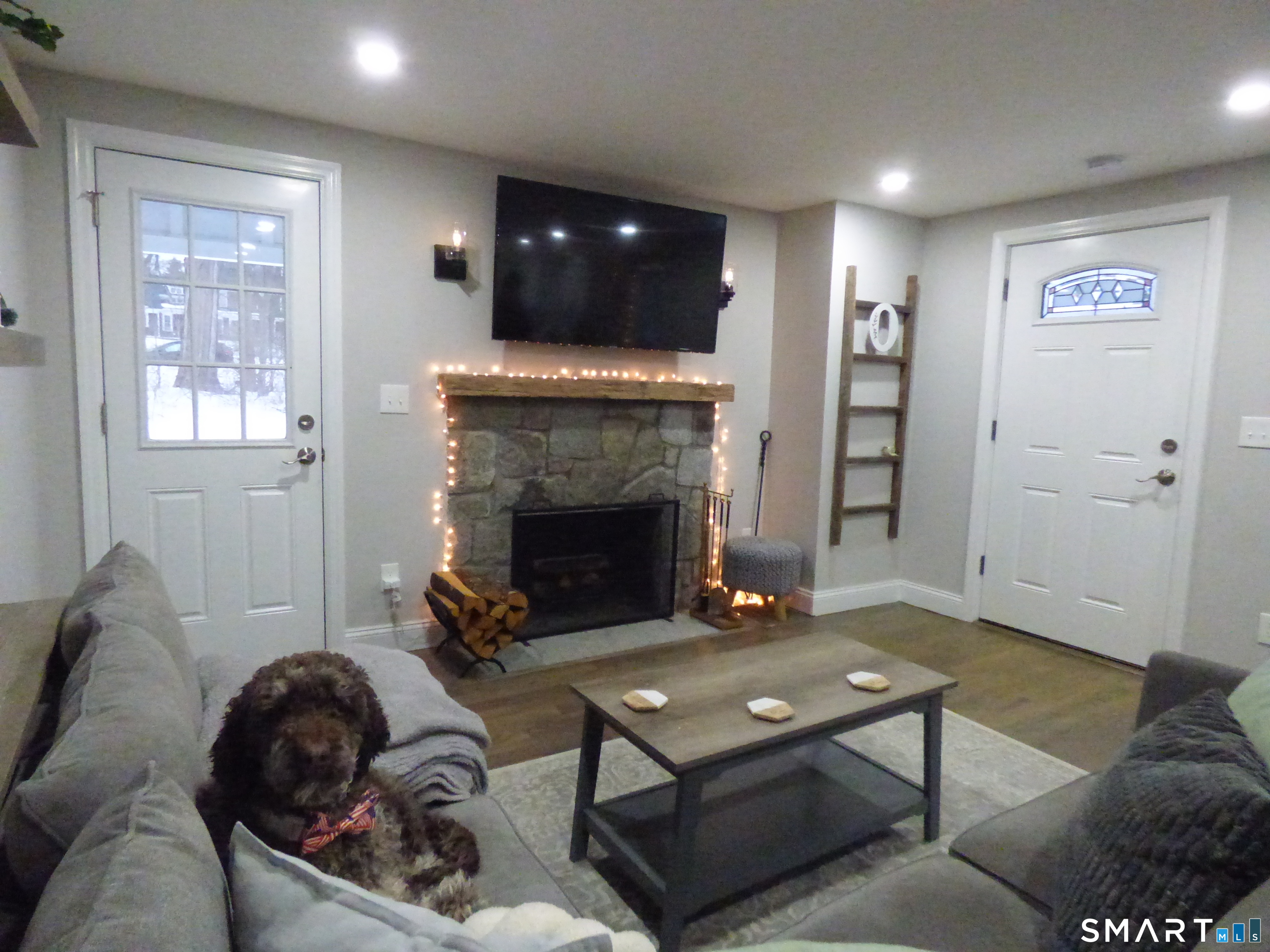 40 Mt Pleasant Road Newtown, CT 06470 - Photo 13 of 23 a living room with furniture and a fireplace