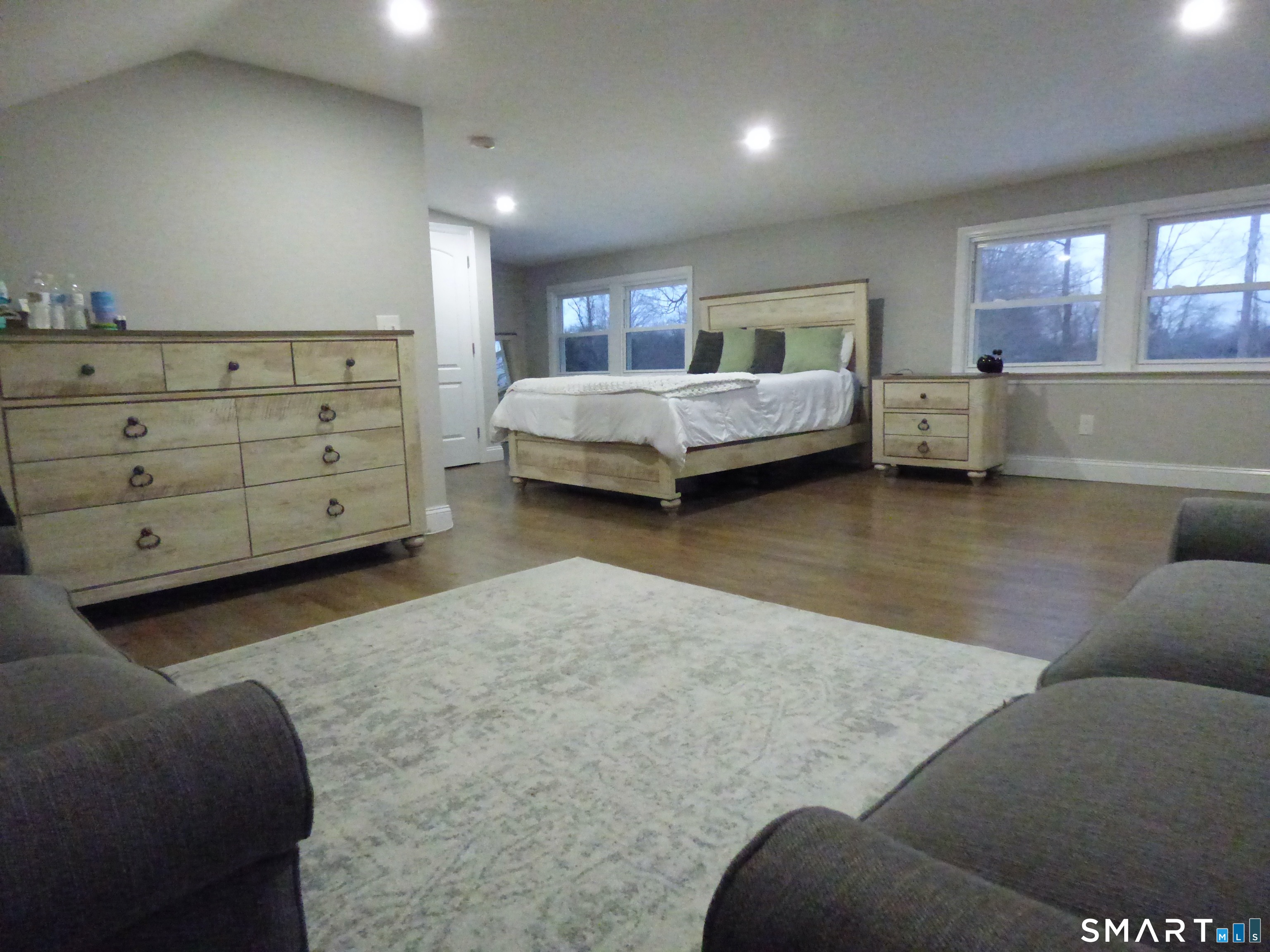 40 Mt Pleasant Road Newtown, CT 06470 - Photo 17 of 23 a bedroom with a bed and a couch