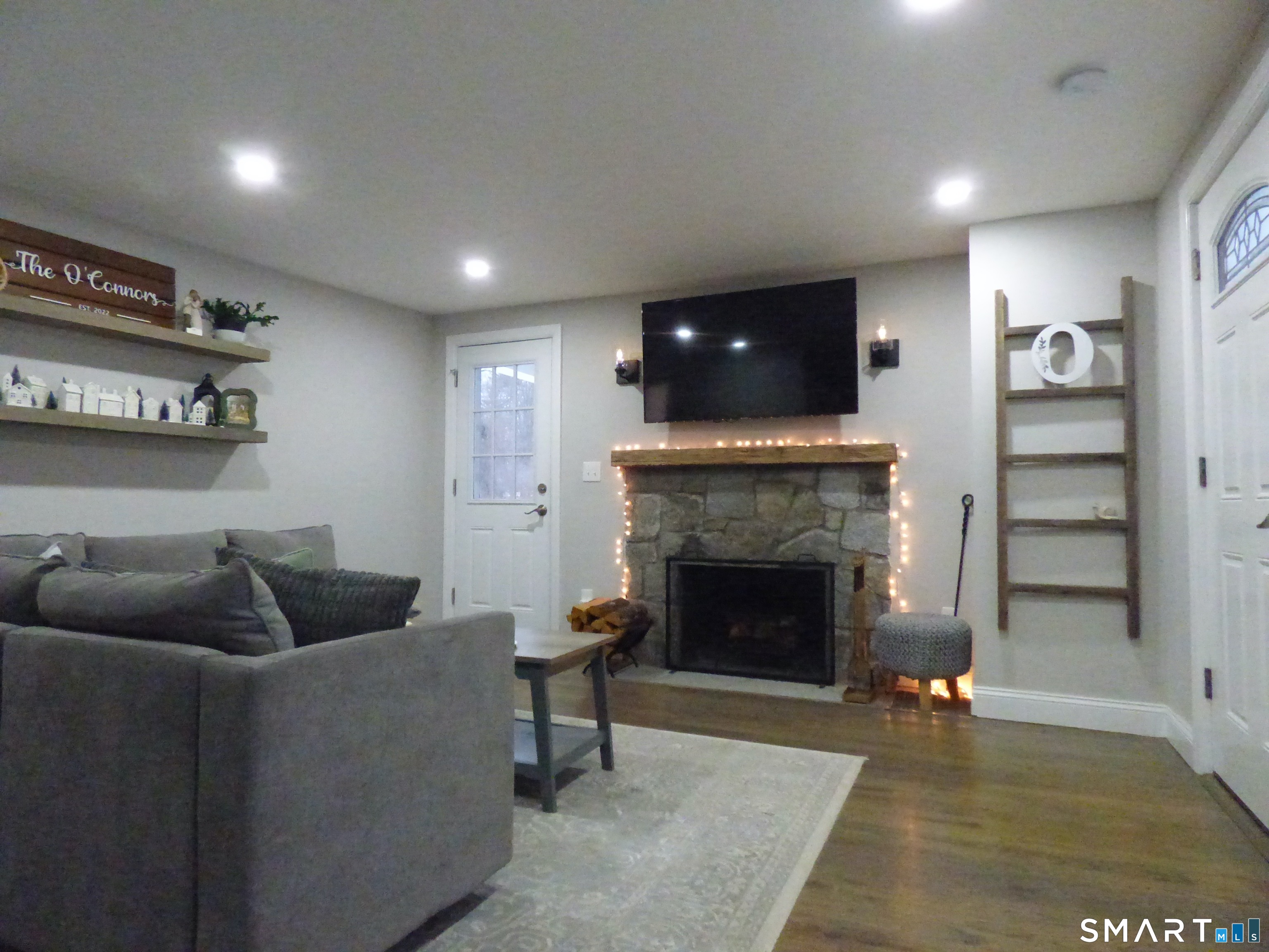 40 Mt Pleasant Road Newtown, CT 06470 - Photo 10 of 23 a living room with furniture and a fireplace