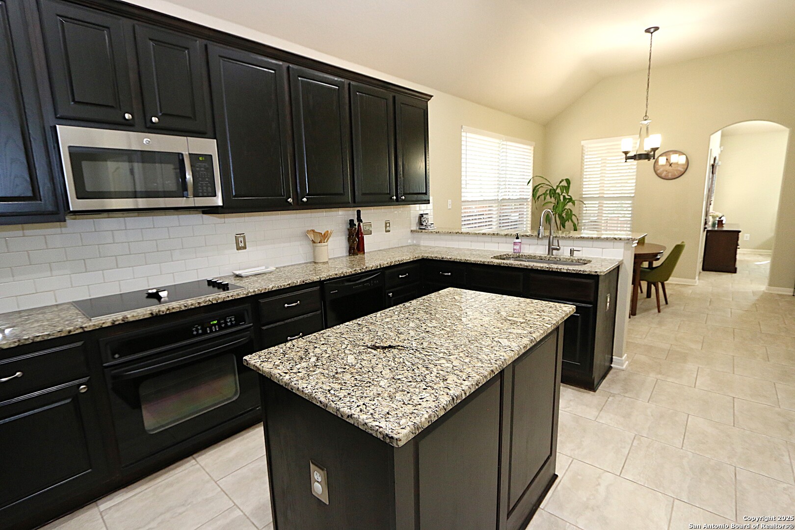 8614 Mantano Ridge Helotes, TX 78023 - Photo 15 of 36 a kitchen with a sink and stove