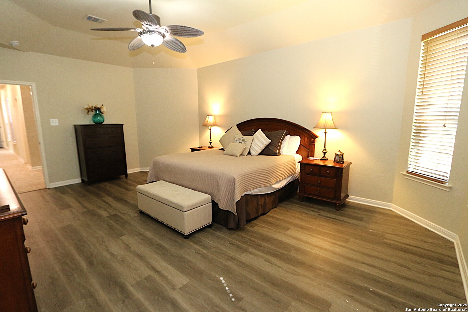 8614 Mantano Ridge Helotes, TX 78023 - Photo 19 of 36 a bedroom with a bed and a window