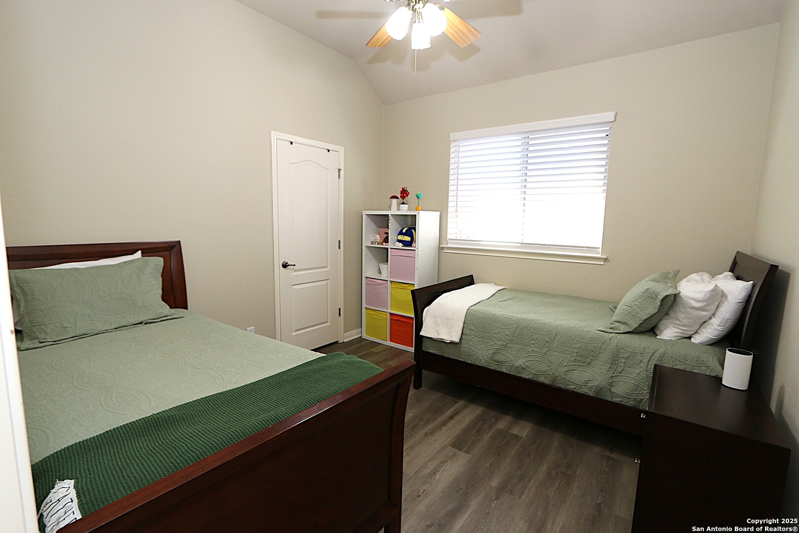 8614 Mantano Ridge Helotes, TX 78023 - Photo 24 of 36 a bedroom with a bed and window