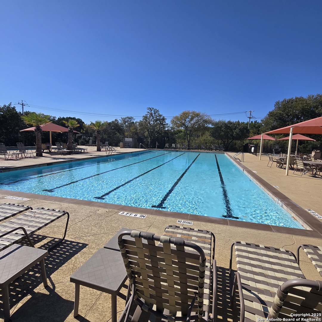 8614 Mantano Ridge Helotes, TX 78023 - Photo 35 of 36 a view of a backyard with sitting area