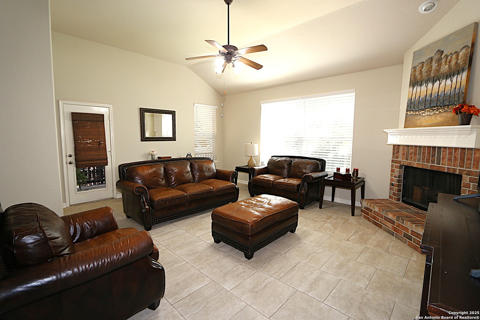 8614 Mantano Ridge Helotes, TX 78023 - Photo 10 of 36 a living room with furniture and a fireplace