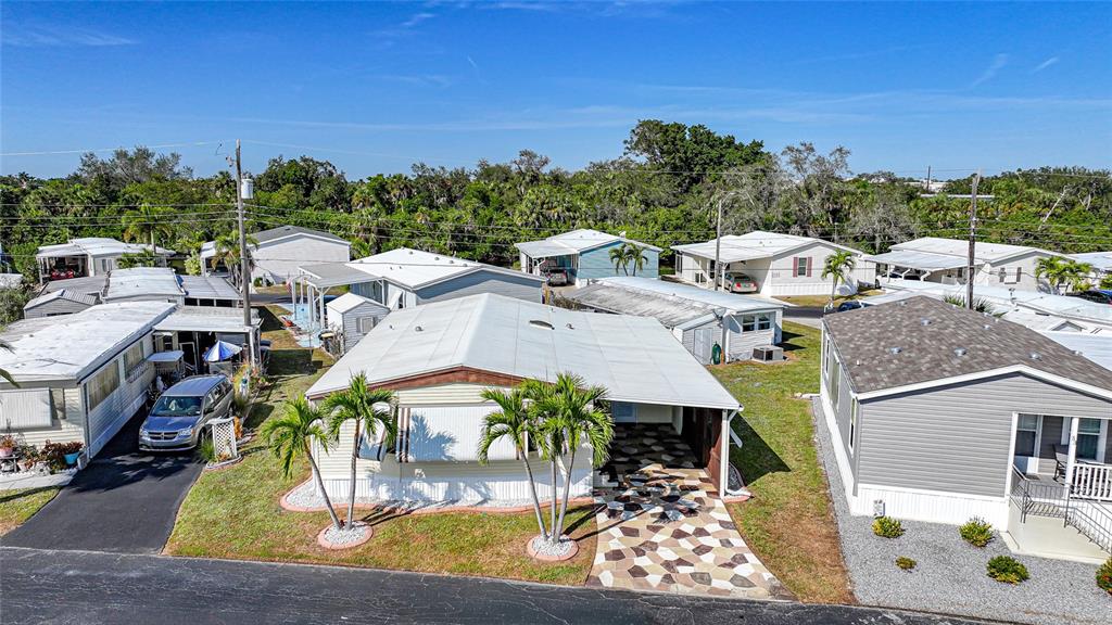 a view of a patio with table and chairs with wooden floor and fence