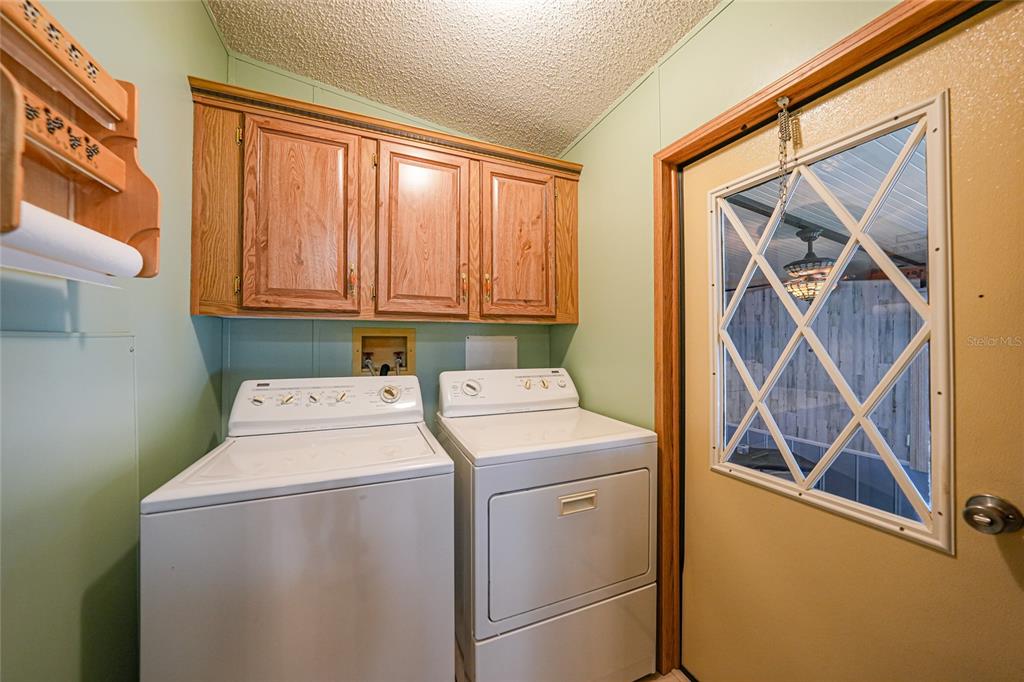 10101 Burnt Store Road, Unit 54 Punta Gorda, FL 33950 - Photo 15 of 28 a utility room with dryer and washer