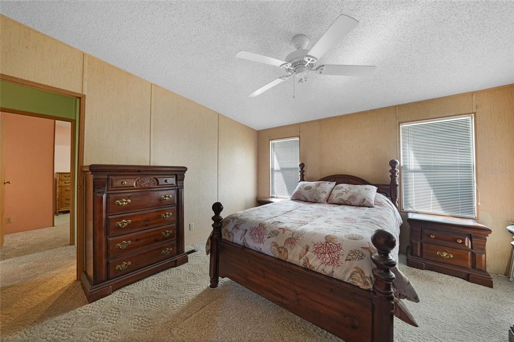 10101 Burnt Store Road, Unit 54 Punta Gorda, FL 33950 - Photo 17 of 28 a bedroom with a bed and a dresser